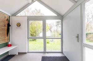 Ferienhaus "Bunter Fisch" - direkt am Deich, Strandübergang 19