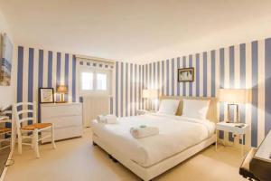 Maisons de vacances La charmante maison blanche : photos des chambres