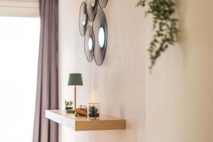 Appartements La Petite Jungle Romantique - Balneo et Detente : photos des chambres