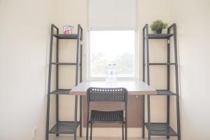 Homey and Simply Look Studio Belmont Residence Puri Apartment By Travelio