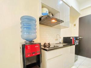 Comfy Studio Room at Grand Asia Afrika Apartment By Travelio