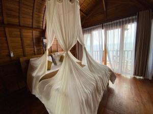 Suwehan Beach Cliff House by BIJAK