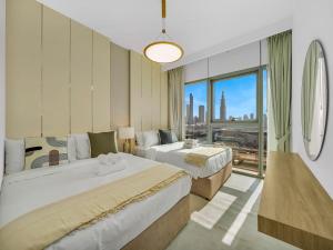 Premium Two-Bedroom Apartment with Private Balcony & Full Burj Khalifa Views by Al Fannan Holiday Homes