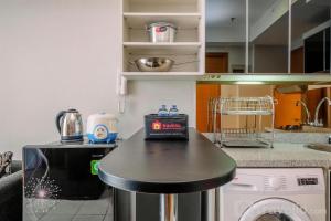 Fancy and Nice 2BR at Cinere Bellevue Apartment By Travelio