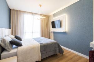 Conforto e Estilo Vista para o Mar Hidromassagem Wi-Fi Ar Condicionado Vaga Privativa e a Passos da Praia