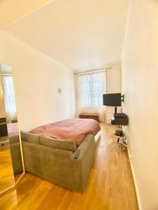 Appartements Grand studio a 12 min de PARIS : photos des chambres