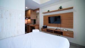 Strategic and Homey Studio at Tamasari Papilio Apartment By Travelio