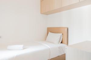 Spacious and Homey Living 3BR at Sky House BSD Apartment By Travelio