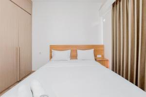 Spacious and Homey Living 3BR at Sky House BSD Apartment By Travelio