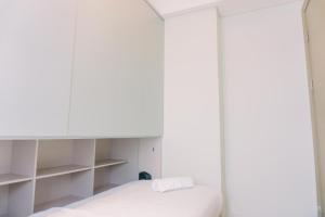 Comfort and Nice 2BR at Gold Coast Apartment By Travelio