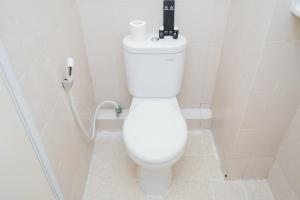 Homey Studio Apartment at Green Palm Residence By Travelio