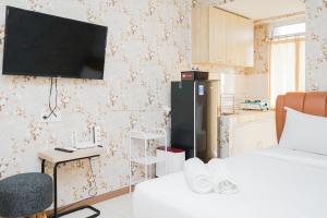 Homey Studio Apartment at Green Palm Residence By Travelio