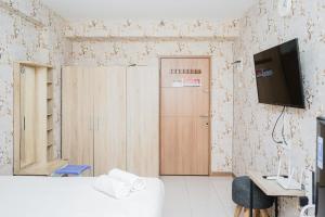 Homey Studio Apartment at Green Palm Residence By Travelio