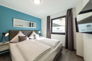 Bewusstsein - Modernes Apartment mit Terrasse, Walk-In-Dusche & Wellnesszugang