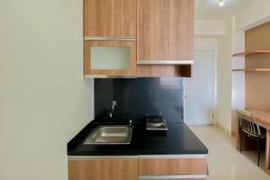Comfort Living Studio at 20th Floor Green Pramuka City Apartment By Travelio