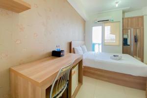 Comfort Living Studio at 20th Floor Green Pramuka City Apartment By Travelio