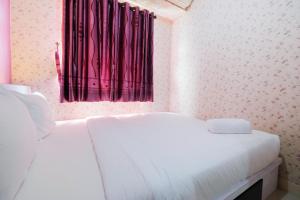 Homey 1BR with Spacious Living Room Green Pramuka City Apartment By Travelio