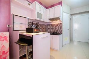 Homey 1BR with Spacious Living Room Green Pramuka City Apartment By Travelio