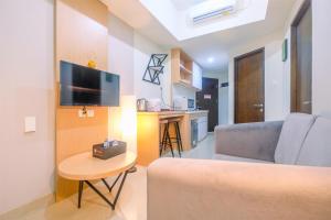 Comfort 1BR Apartment at Mustika Golf Residences By Travelio