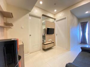 Pleasant 1BR Apartment at Parahyangan Residence near UNPAR By Travelio