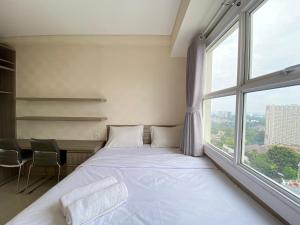Pleasant 1BR Apartment at Parahyangan Residence near UNPAR By Travelio