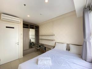 Pleasant 1BR Apartment at Parahyangan Residence near UNPAR By Travelio