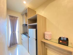 Pleasant 1BR Apartment at Parahyangan Residence near UNPAR By Travelio