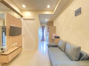 Pleasant 1BR Apartment at Parahyangan Residence near UNPAR By Travelio