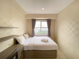 Pleasant 1BR Apartment at Parahyangan Residence near UNPAR By Travelio