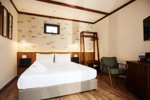 Phòng Có Giường Cỡ Queen Nhìn Ra Vườn (Queen Room with Garden View)