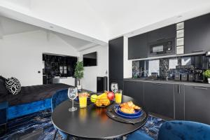 Appartements Suite prestige avec jacuzzi : photos des chambres