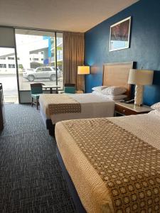 Queen Room with Two Queen Beds and Roll-in Shower - Mobility Accessible/Non-Smoking room in Days Inn by Wyndham Virginia Beach At The Beach