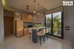 Villa De Suku by VEO, StayVista - 3BHK with Mountain View & Garden
