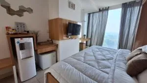 7 min to ICE 1BR with Wifi, Netflix, AC, Kitchen, TV, Swimming Pool, Gym, Free Parking - Dadap