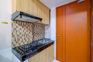 Homey Studio at 10th Floor Margonda Residence 5 Apartment By Travelio