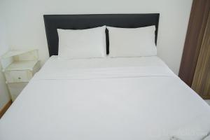 Restful and Cozy 2BR Apartment at M-Town Residence By Travelio