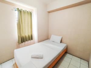 Minimalist 3BR Gateway Ahmad Yani Cicadas Apartment By Travelio