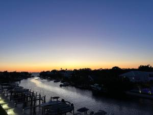 Luxury 2 Bed 2 Bath Waterfront Condo with Patio Sunsets Gym and Parking