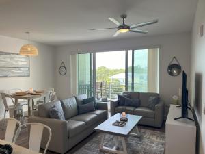 Luxury 2 Bed 2 Bath Waterfront Condo with Patio Sunsets Gym and Parking