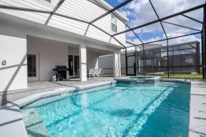 Modern Paradise at Windsor Cay pool and Game Room