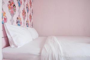 Homey and Fresh 2BR Green Pramuka Apartment By Travelio