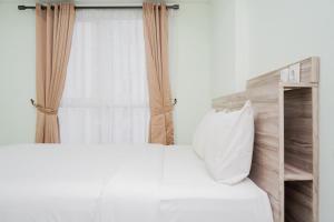 Comfortable 1BR at Casa de Parco Apartment By Travelio