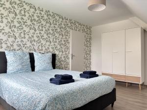 Maisons de vacances Les dunes, maison neuve 8 p bien equipee jardin clos, parking, garage a 850 m de la plage et centre bourg, sur plages du debarquement pres Arromanches et Bayeux : photos des chambres
