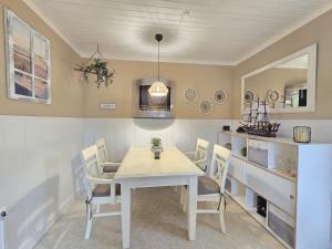 Ferienhaus Lüttje Uttiet mit eingezäunten Garten