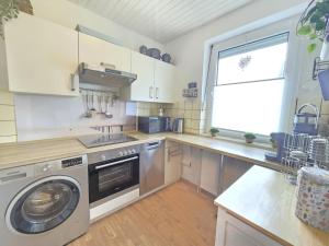 Ferienhaus Lüttje Uttiet mit eingezäunten Garten