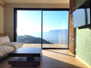 Appartements Logement avec jacuzzi et sauna en terrasse, belle vue panoramique : photos des chambres