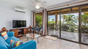 Elegant Condo with Brand-New Fixtures, Shaded Tropical Terrace, and Secluded Beach Access