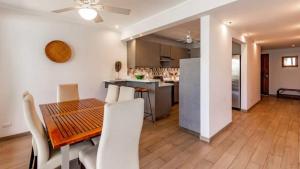 Elegant Condo with Brand-New Fixtures, Shaded Tropical Terrace, and Secluded Beach Access