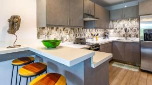 Elegant Condo with Brand-New Fixtures, Shaded Tropical Terrace, and Secluded Beach Access