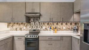 Elegant Condo with Brand-New Fixtures, Shaded Tropical Terrace, and Secluded Beach Access